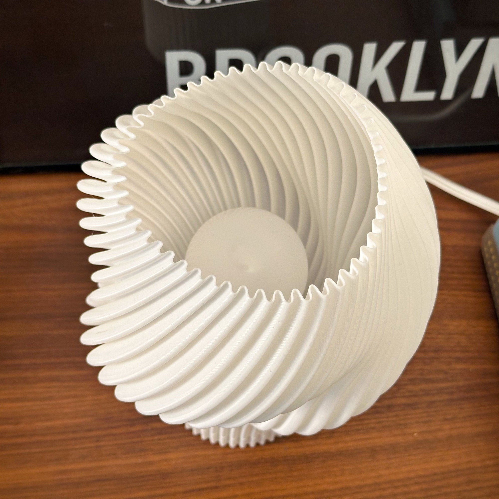 Flourish lamp detail showing the pleated shade, viewed from above