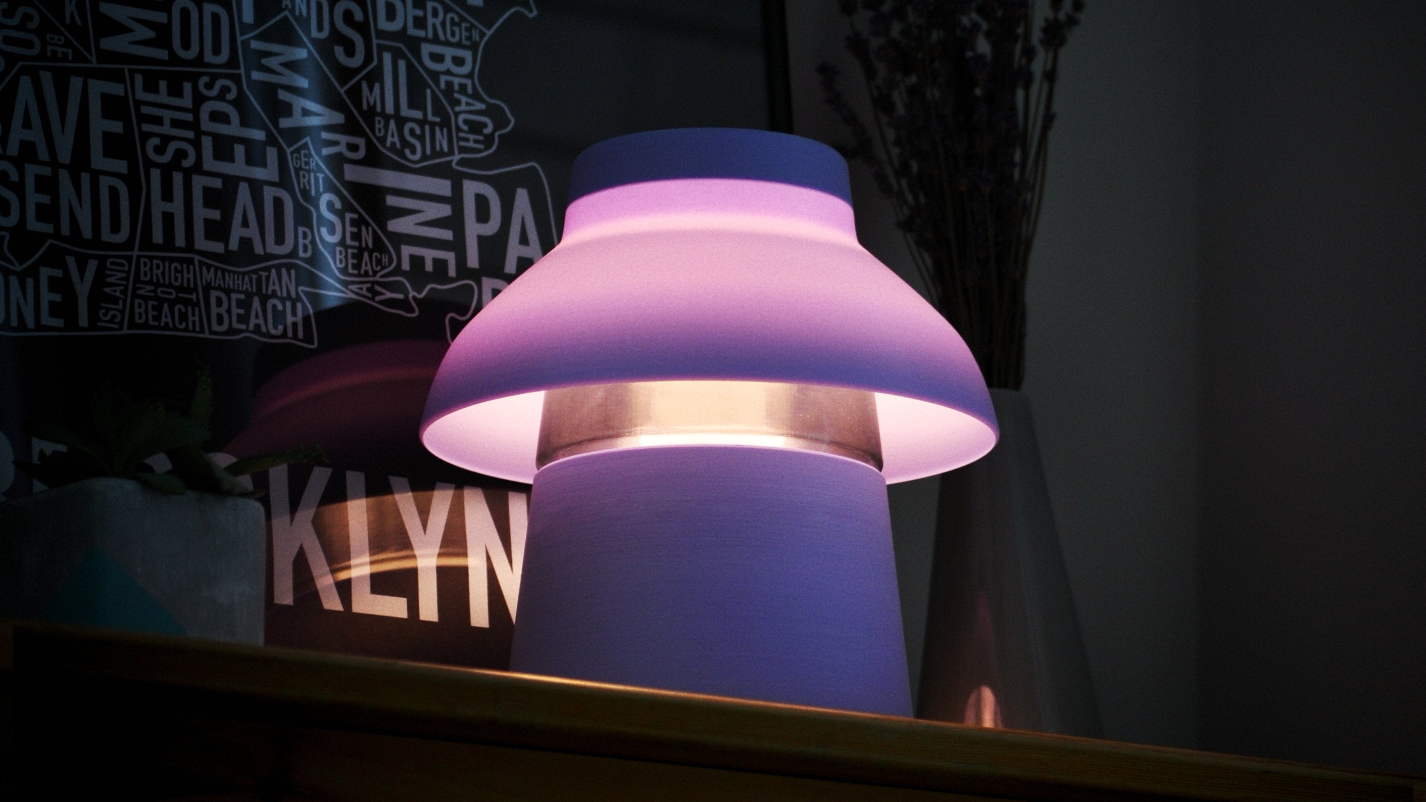 Purple lamp with a glowing interior on a dark background